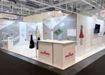 Murata stand - 0 walls space, graphic walls creating meeting room and display areas