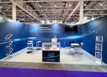 Stand for Tower Semiconductors, 3 walls, 2 tables/chairs, 2 literature racks and a display counter