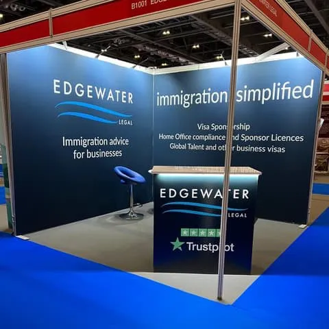 Edgewater exhibition stand - 2 walls, edge-lit front counter and table & chairs